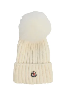 Cream merino wool circular rib beanie with faux fur pom pom