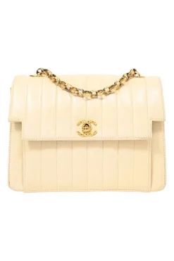 Cream vertical quilted lambskin leather Mademoiselle flap bag with gold-plated hardware
