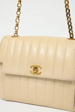 Cream vertical quilted lambskin leather Mademoiselle flap bag with gold-plated hardware