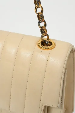 Cream vertical quilted lambskin leather Mademoiselle flap bag with gold-plated hardware