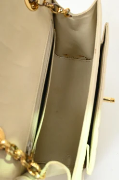 Cream vertical quilted lambskin leather Mademoiselle flap bag with gold-plated hardware