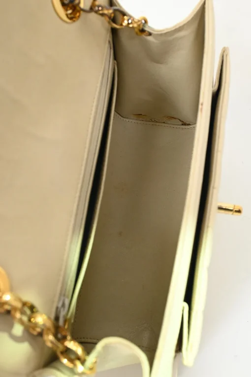 Cream vertical quilted lambskin leather Mademoiselle flap bag with gold-plated hardware