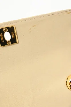 Cream vertical quilted lambskin leather Mademoiselle flap bag with gold-plated hardware