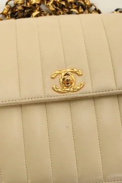 Cream vertical quilted lambskin leather Mademoiselle flap bag with gold-plated hardware