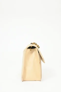Cream vertical quilted lambskin leather Mademoiselle flap bag with gold-plated hardware