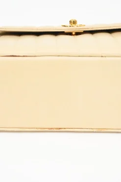 Cream vertical quilted lambskin leather Mademoiselle flap bag with gold-plated hardware