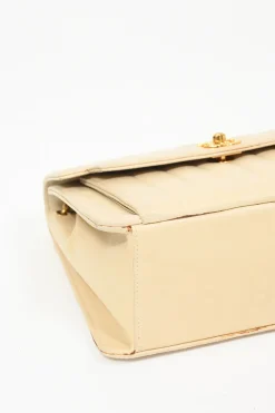 Cream vertical quilted lambskin leather Mademoiselle flap bag with gold-plated hardware