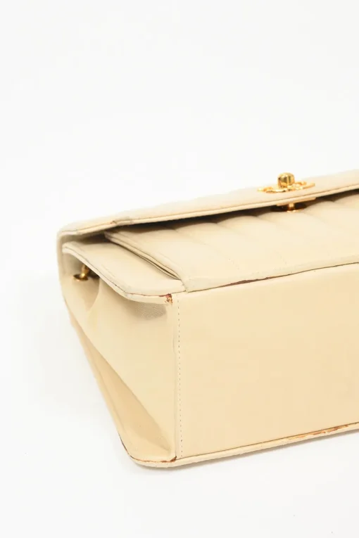 Cream vertical quilted lambskin leather Mademoiselle flap bag with gold-plated hardware