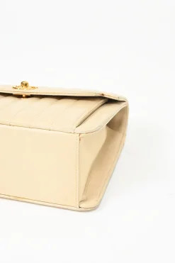 Cream vertical quilted lambskin leather Mademoiselle flap bag with gold-plated hardware
