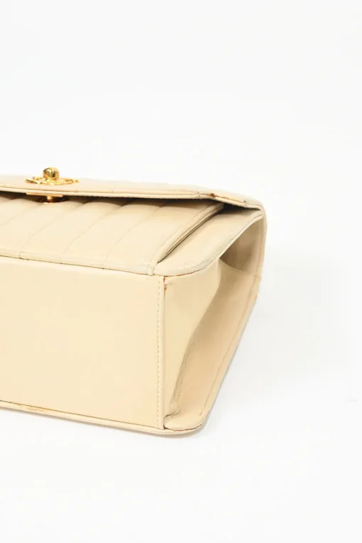 Cream vertical quilted lambskin leather Mademoiselle flap bag with gold-plated hardware