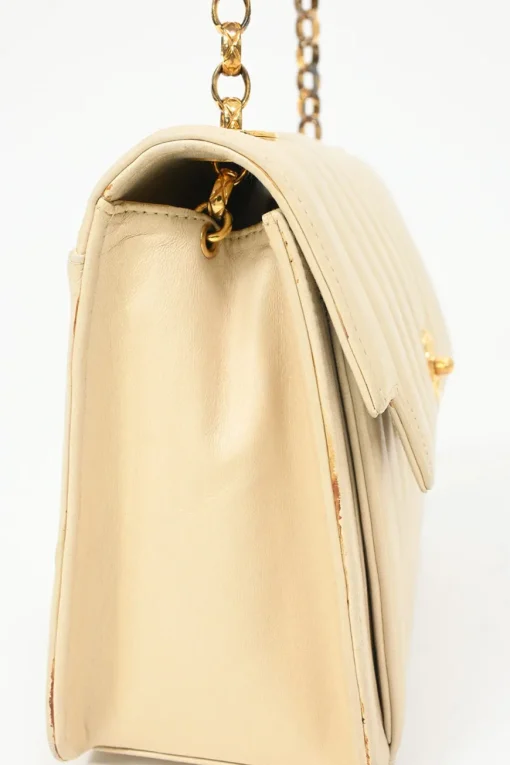 Cream vertical quilted lambskin leather Mademoiselle flap bag with gold-plated hardware