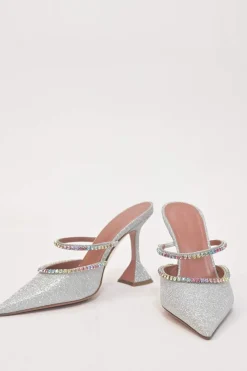 Crystal-embellished silver-tone metallic Gilda 105 pointed-toe mules with fixed mid-arch vamp strap and signature comma heels