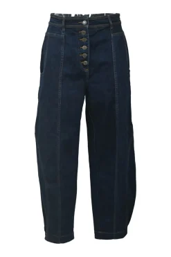 Dark indigo cotton denim pull-on high-rise bow leg jeans with exposed button fly fastening