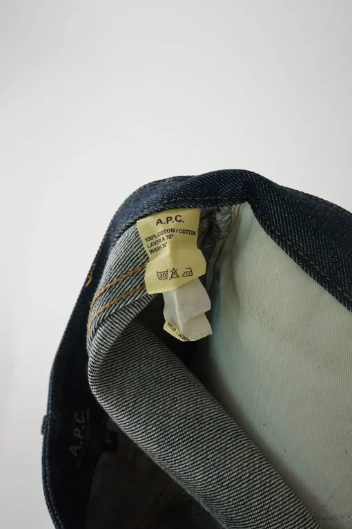 Dark indigo cotton denim low-rise five-pocket mini skirt with belt loop waistband