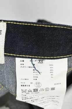 Dark indigo cotton denim straight-leg boro jeans featuring mixed-media patch appliqué