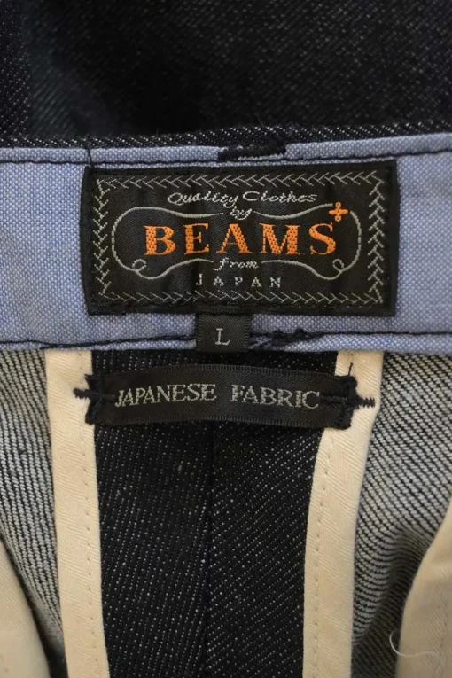 Dark indigo cotton-blend denim pull-on straight-leg pants with Martingale, waist adjusters and extended tab closure
