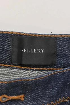 Dark indigo cotton-blend high-rise bell-bottom jeans with exposed button fly