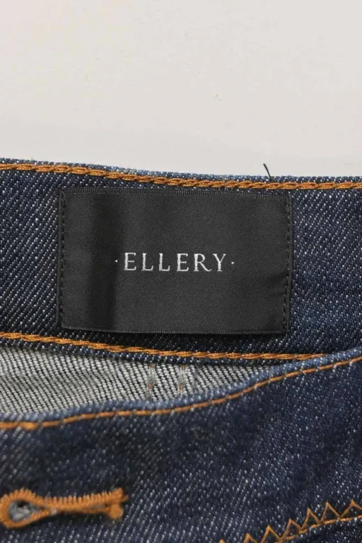 Dark indigo cotton-blend high-rise bell-bottom jeans with exposed button fly