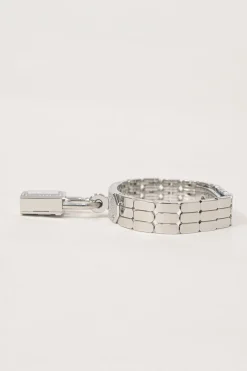 Diamond-set steel Kelly Mini Model 16mm convertible watch featuring detachable padlock