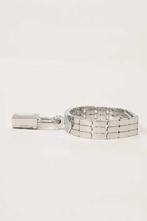 Diamond-set steel Kelly Mini Model 16mm convertible watch featuring detachable padlock