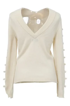 Ecru cashmere portrait neck pullover sweater featuring cutout sleeves with camellia appliqué