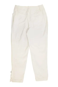 Ecru cotton denim pull-on high-rise skinny jeans with Coco Mark shank button appliqué along cuffs