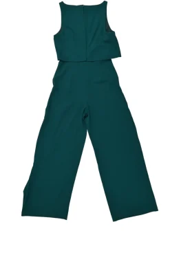 Emerald green draped polyester crêpe bi-layer jumpsuit with cascade ruffle hip detailing