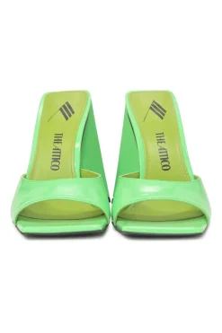 Fluo green patent leather Devon slide mules with square toes and pyramid heels