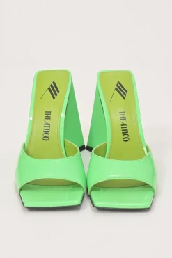 Fluo green patent leather Devon slide mules with square toes and pyramid heels