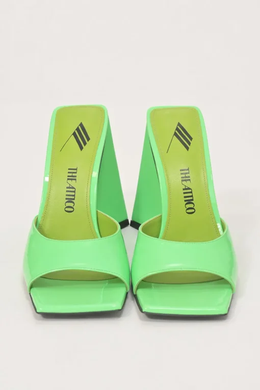 Fluo green patent leather Devon slide mules with square toes and pyramid heels