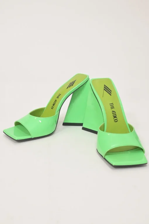 Fluo green patent leather Devon slide mules with square toes and pyramid heels