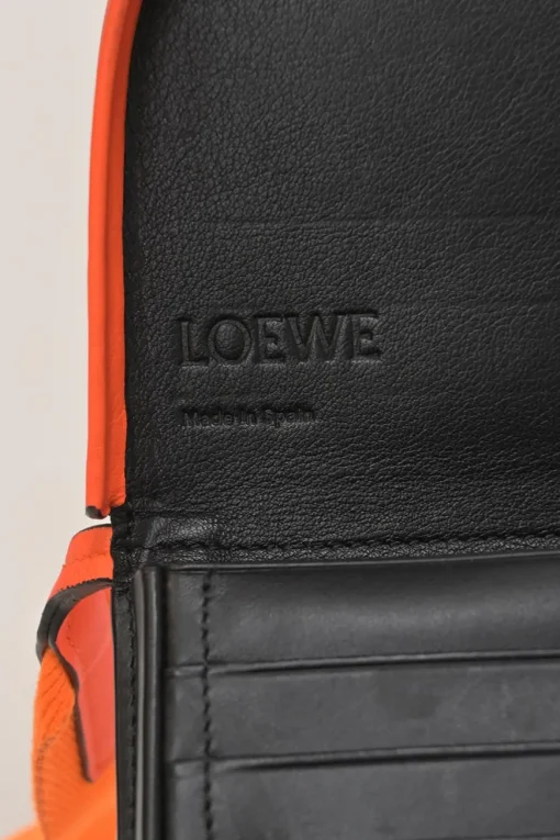 Fluo orange anagram-embossed leather Heel Pouch crossbody bag