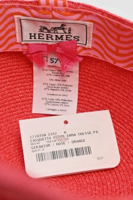 Geranium braided paper Emma cap featuring 'H vagues' and lacquered Clou de Selle appliqués