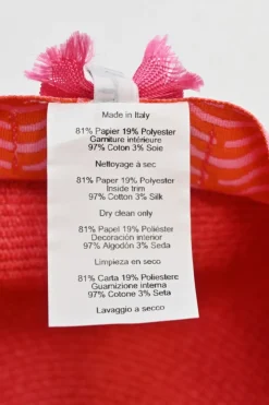 Geranium braided paper Emma cap featuring 'H vagues' and lacquered Clou de Selle appliqués