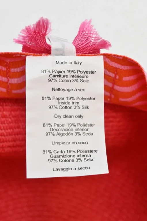 Geranium braided paper Emma cap featuring 'H vagues' and lacquered Clou de Selle appliqués