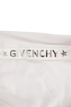 Givenchy white sports skirt with elasticated waist band, drawstring, side pockets with zips, and branding in mirror letters on sides