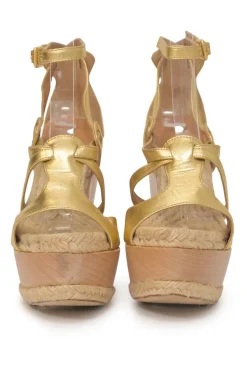 Gold foiled lambskin, raffia, and wood cutout platform wedge sandals with buckle strap fastening