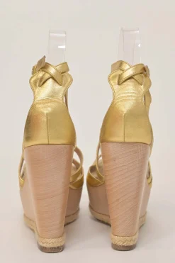 Gold foiled lambskin, raffia, and wood cutout platform wedge sandals with buckle strap fastening