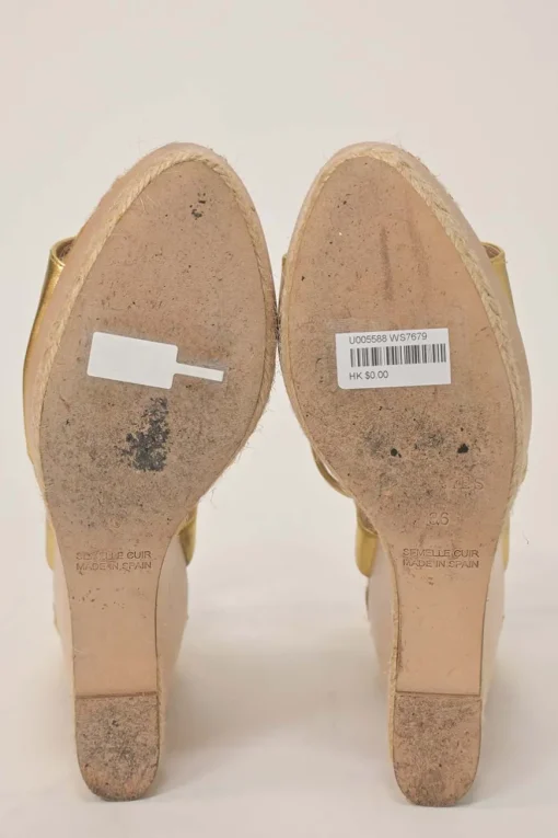 Gold foiled lambskin, raffia, and wood cutout platform wedge sandals with buckle strap fastening