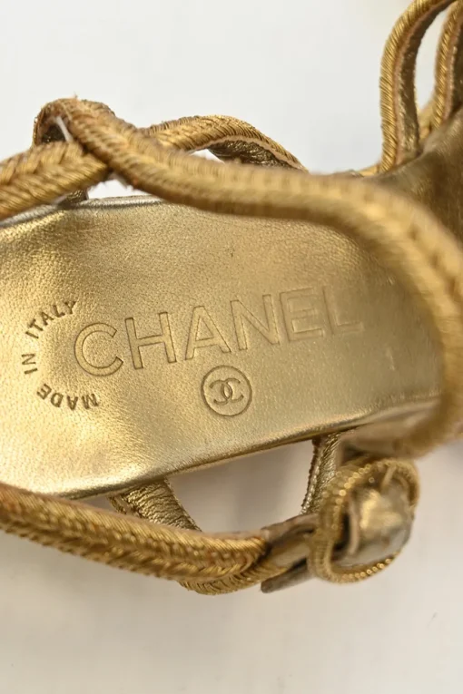 Gold foiled leather and straw almond-toe criss-cross wedge sandals with buckle strap fastening