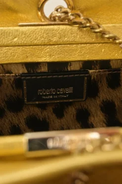 Gold foiled leather frog tassel clutch with gold-tone metallic hardware