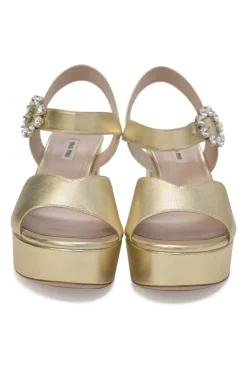Gold foiled leather round-toe platform sandals with embellished buckle strap fastening