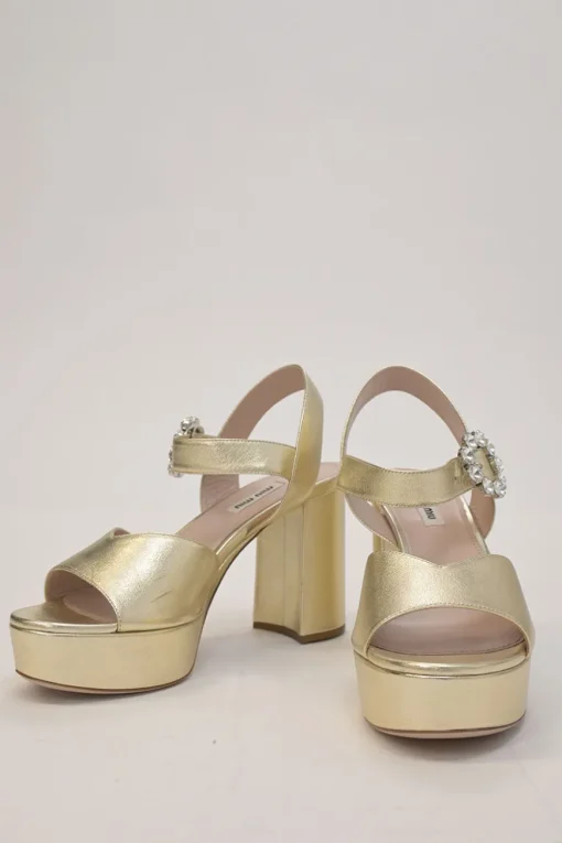 Gold foiled leather round-toe platform sandals with embellished buckle strap fastening