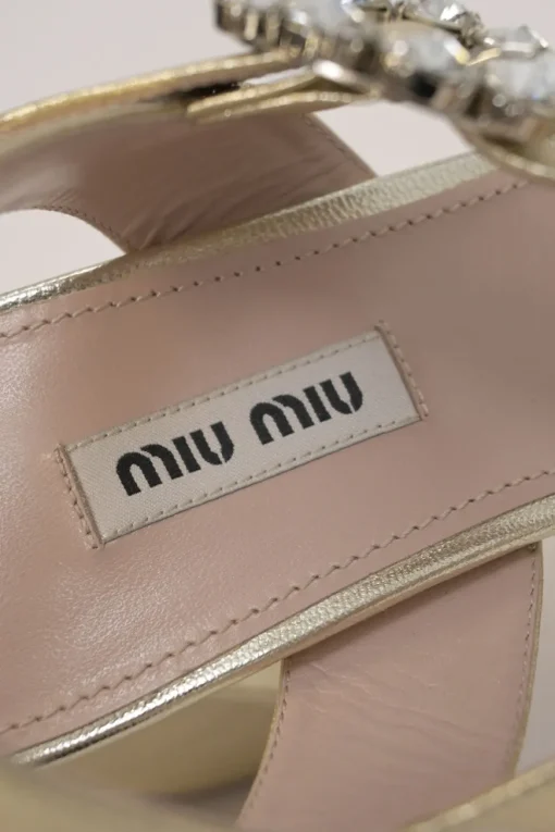 Gold foiled leather round-toe platform sandals with embellished buckle strap fastening