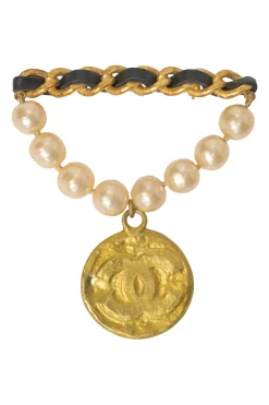 Gold-finish hammered metal, leather, and resin faux pearl Coco Mark medallion brooch