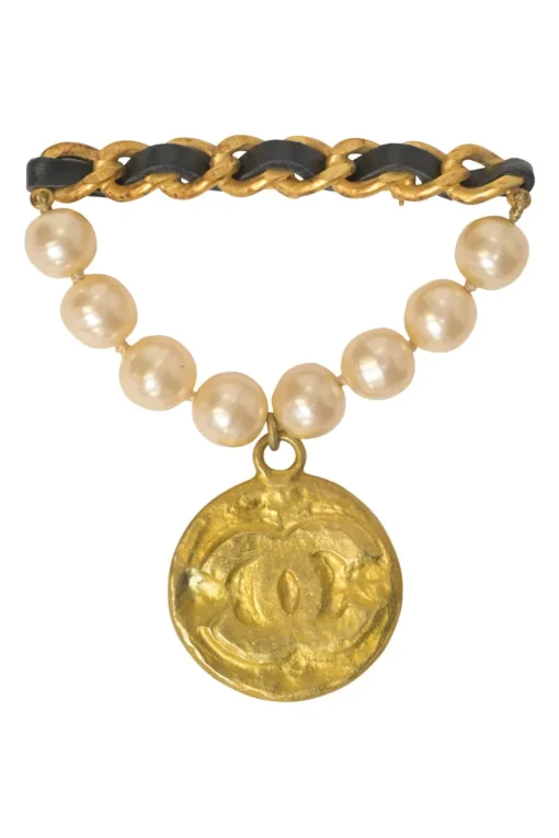 Gold-finish hammered metal, leather, and resin faux pearl Coco Mark medallion brooch