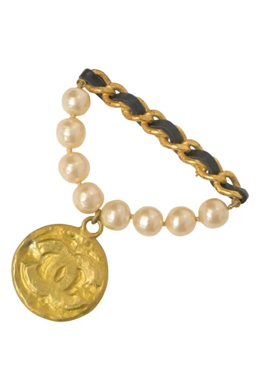 Gold-finish hammered metal, leather, and resin faux pearl Coco Mark medallion brooch
