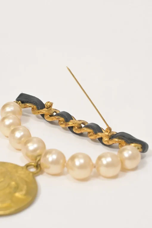 Gold-finish hammered metal, leather, and resin faux pearl Coco Mark medallion brooch