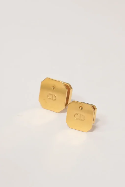 Gold-finish metal and enamel octagon CD clover plaque clip-back earrings