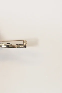 Gold-finish metal and leather Coco Mark brooch